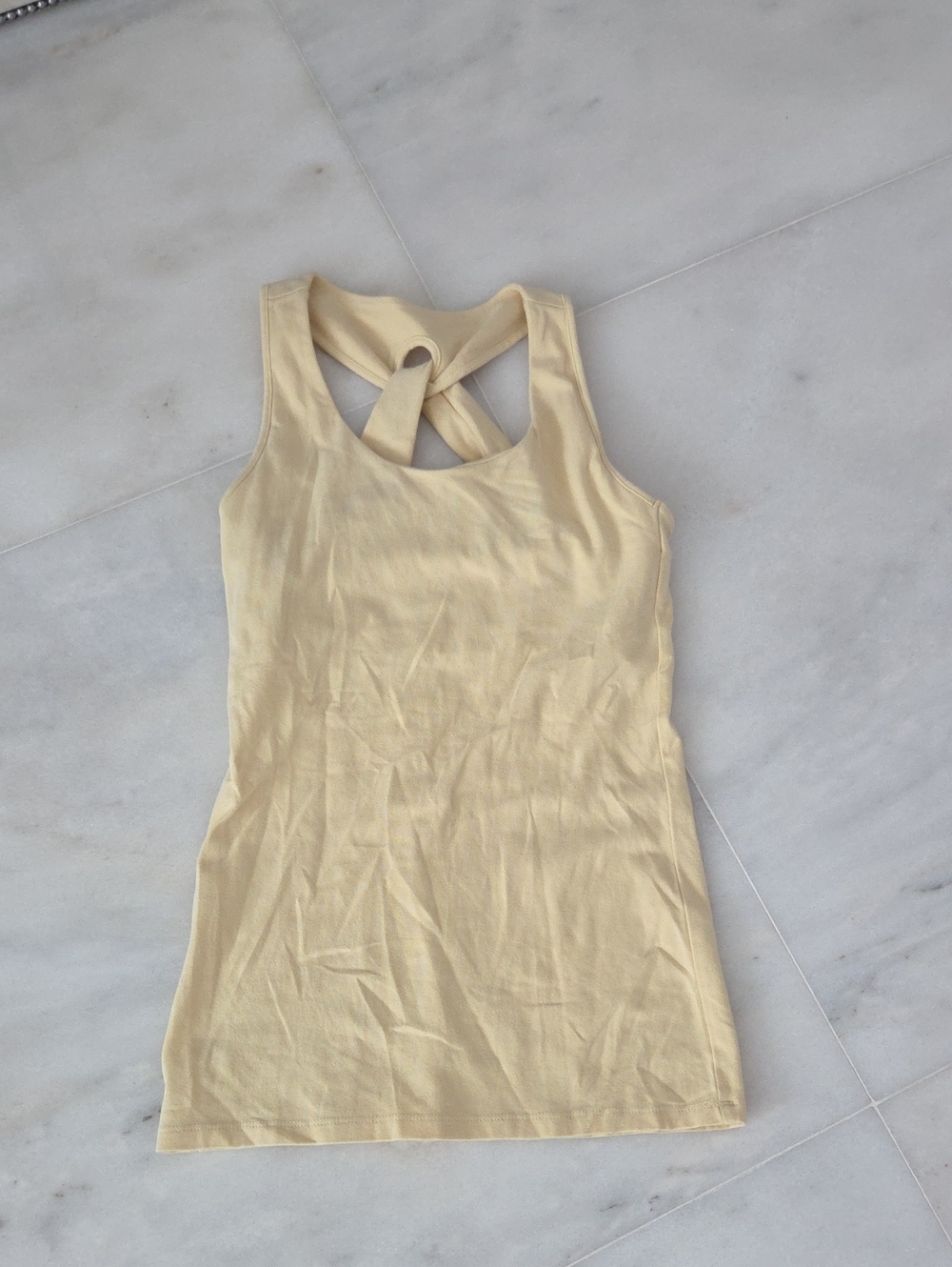 Stem Sleeveless Twist-Back Tank Top in Pale Yellow